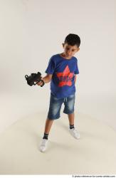 TIMBO STANDING POSE WITH GUN